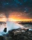 Waves Washing Over Rocks at Sunrise