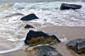 Waves Washing Up Over and Around Jetty Rocks