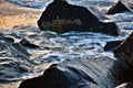 Waves Washing Up Over and Around Jetty Rocks