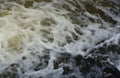 Waves of water of the river and the sea meet each other during high tide and low tide. Deep blue stormy sea water Royalty Free Stock Photo