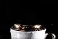 Waves of water on the surface of the cup on a black background Royalty Free Stock Photo