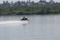 Waves and Young guy cruising on the atlantic ocean on a jet ski Royalty Free Stock Photo