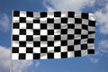 Waving checkered flag in front of a cloudy sky Royalty Free Stock Photo