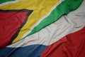 waving colorful flag of czech republic and national flag of guyana Royalty Free Stock Photo