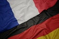 waving colorful flag of germany and national flag of france Royalty Free Stock Photo