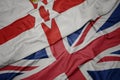 waving colorful flag of great britain and national flag of northern ireland Royalty Free Stock Photo