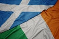 waving colorful flag of ireland and national flag of scotland Royalty Free Stock Photo