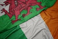 waving colorful flag of ireland and national flag of wales Royalty Free Stock Photo