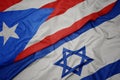 waving colorful flag of israel and national flag of puerto rico Royalty Free Stock Photo