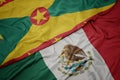 Waving colorful flag of mexico and national flag of grenada.