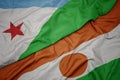 waving colorful flag of niger and national flag of djibouti Royalty Free Stock Photo