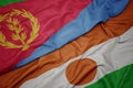 waving colorful flag of niger and national flag of eritrea Royalty Free Stock Photo