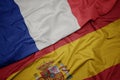 waving colorful flag of spain and national flag of france Royalty Free Stock Photo