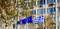 Waving colorful Greece and EU flags