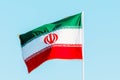 Waving colorful Iran flag on blue sky. Royalty Free Stock Photo