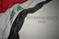 waving colorful national flag of iraq on a gray background with text independence day Royalty Free Stock Photo