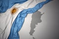 Waving colorful national flag and map of argentina. Royalty Free Stock Photo