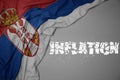 waving colorful national flag of serbia on a gray background with broken text inflation. 3d illustration Royalty Free Stock Photo