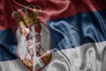 colorful shining big national flag of serbia on a silky texture Royalty Free Stock Photo