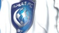 Waving flag with Al Hilal FC football club logo, close-up. Editorial 3D rendering