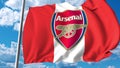Waving flag with Arsenal football team logo. Editorial 3D rendering
