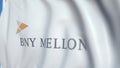 Waving flag with The Bank Of New York Mellon logo, close-up. Editorial loopable 3D animation