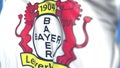 Waving flag with Bayer Leverkusen football club logo, close-up. Editorial 3D rendering