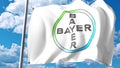 Waving flag with Bayer AG logo against clouds and sky. Editorial 3D rendering