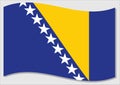 Waving flag of Bosnia and Herzegovina vector graphic. Waving Bosniak flag illustration. Bosnia and Herzegovina country flag wavin