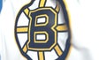 Waving flag with Boston Bruins NHL hockey team logo, close-up. Editorial 3D rendering