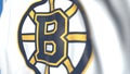 Waving flag with Boston Bruins NHL hockey team logo, close-up. Editorial loopable 3D animation