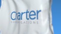 Flying flag with Charter Communications logo, close-up. Editorial 3D rendering Royalty Free Stock Photo
