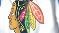 Waving flag with Chicago Blackhawks NHL hockey team logo, close-up. Editorial 3D rendering