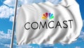 Waving flag with Comcast logo. Editoial 3D rendering