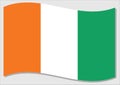 Waving flag of Cote de I`voire vector graphic. Waving Ivorian flag illustration. Cote de I`voire country flag wavin in the wind