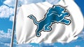 Waving flag with Detroit Lions professional team logo. Editorial 3D rendering