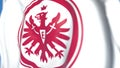 Flying flag with Eintracht Frankfurt football club logo, close-up. Editorial 3D rendering