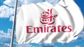 Waving flag with Emirates Airline logo. 3D rendering