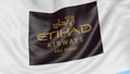 Waving flag of Etihad Airways against blue sky background, seamless loop. Editorial 4K animation