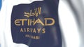 Waving flag with Etihad Airways logo, close-up. Editorial loopable 3D animation