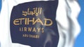 Waving flag with Etihad Airways logo, close-up. Editorial 3D rendering