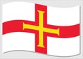 Waving flag of Guernsey vector graphic. Waving Guernesiais flag illustration. Guernsey country flag wavin in the wind is a symbol