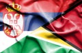 Waving flag of Guyana and Serbia