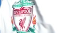 Waving flag with Liverpool football team logo, close-up. Editorial 3D rendering
