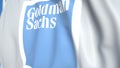 Waving flag with The Goldman Sachs Group, Inc. logo, close-up. Editorial 3D rendering