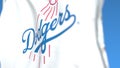 Waving flag with Los Angeles Dodgers team logo, close-up. Editorial 3D rendering