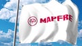 Waving flag with Mapfre logo against clouds and sky. Editorial 3D rendering