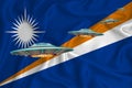 Waving flag of Marshall Islands. UFO group on the background of the flag. UFO news concept in the country. 3D rendering
