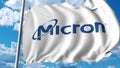 Waving flag with Micron Technology logo. 4K editorial animation