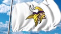 Waving flag with Minnesota Vikings professional team logo. Editorial 3D rendering